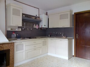 Fridge, stovetop, coffee/tea maker, cookware/dishes/utensils