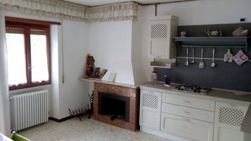 Fridge, stovetop, coffee/tea maker, cookware/dishes/utensils