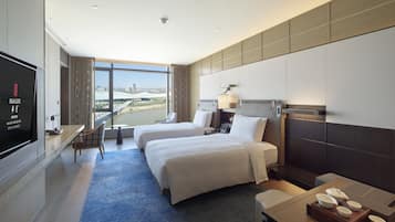 Premium bedding, down comforters, free minibar items, in-room safe