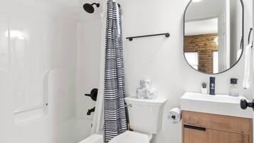 Bathtub, hair dryer, towels