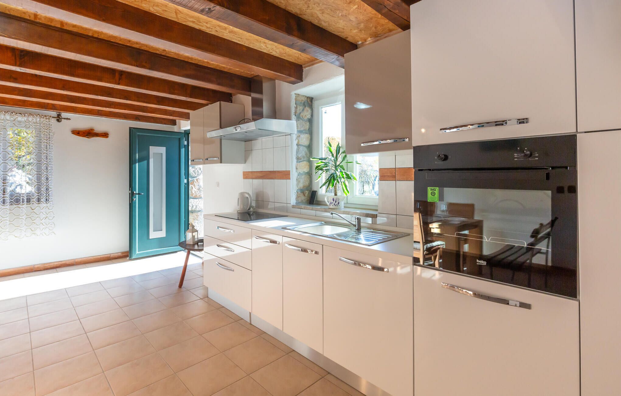 Fridge, stovetop, dishwasher, coffee/tea maker