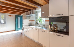 Fridge, stovetop, dishwasher, coffee/tea maker