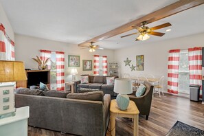 Flat-screen TV, DVD player, books, video library
