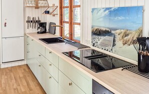 Fridge, stovetop, dishwasher, coffee/tea maker