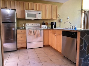 Enjoy cooking in this well-equipped kitchen with a refrigerator, microwave, double oven, and dishwasher.