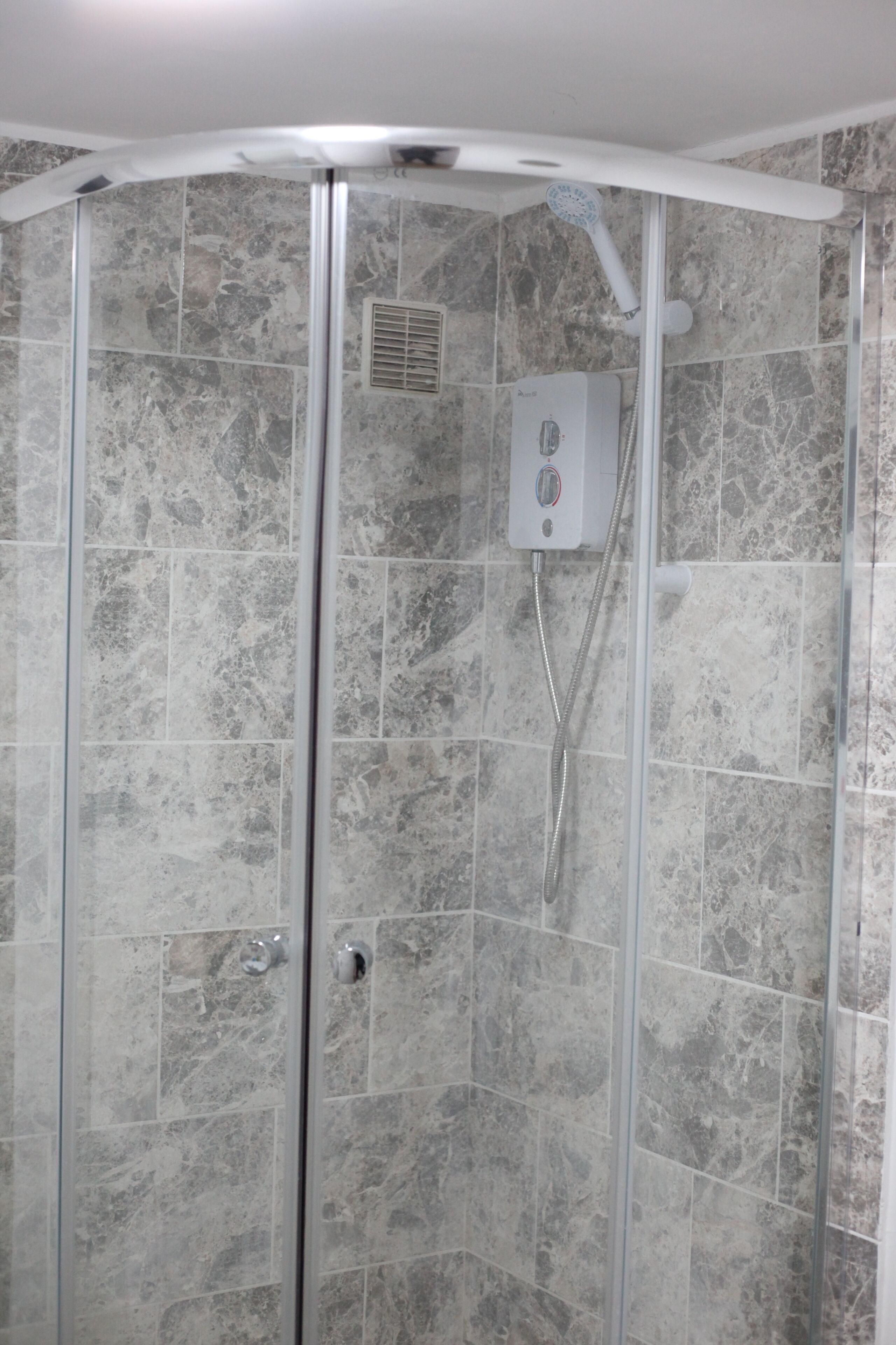 Shower, rainfall showerhead, hair dryer, towels