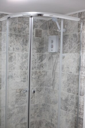 Shower, rainfall showerhead, hair dryer, towels