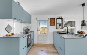 Fridge, stovetop, dishwasher, coffee/tea maker