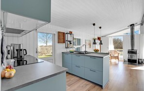 Fridge, stovetop, dishwasher, coffee/tea maker