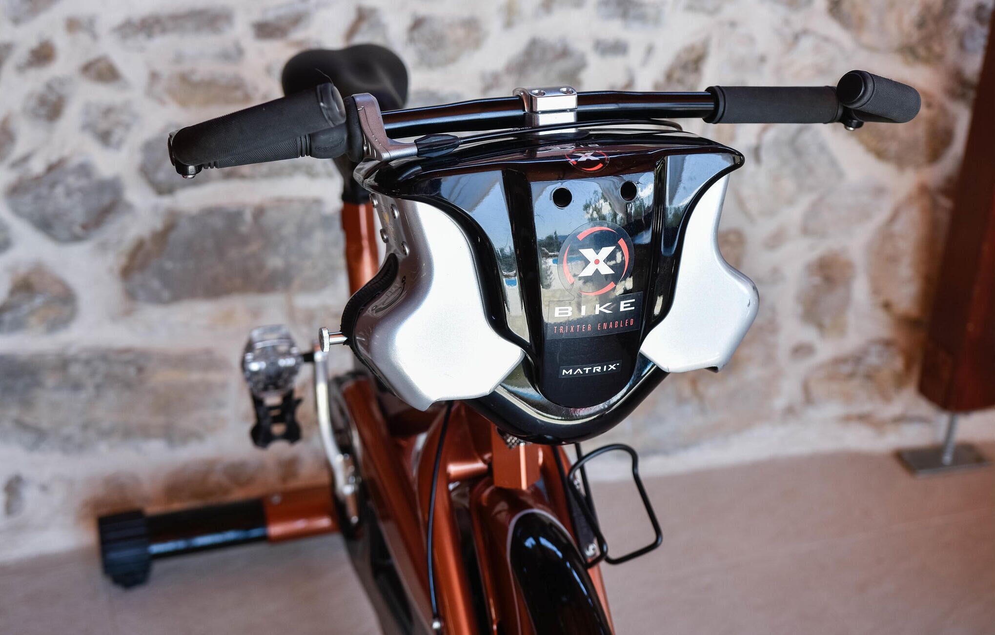A bicycle with a Matrix-branded handlebar and a traxter-enabled bike logo.