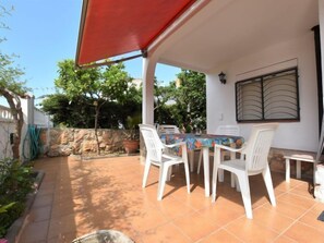 Enjoy al fresco dining on the patio, surrounded by lush gardens.