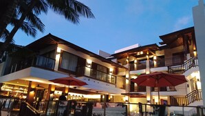 A multi-story hotel with outdoor seating and a pool. - Mandarin White Sand Boracay (Boracay Island)
