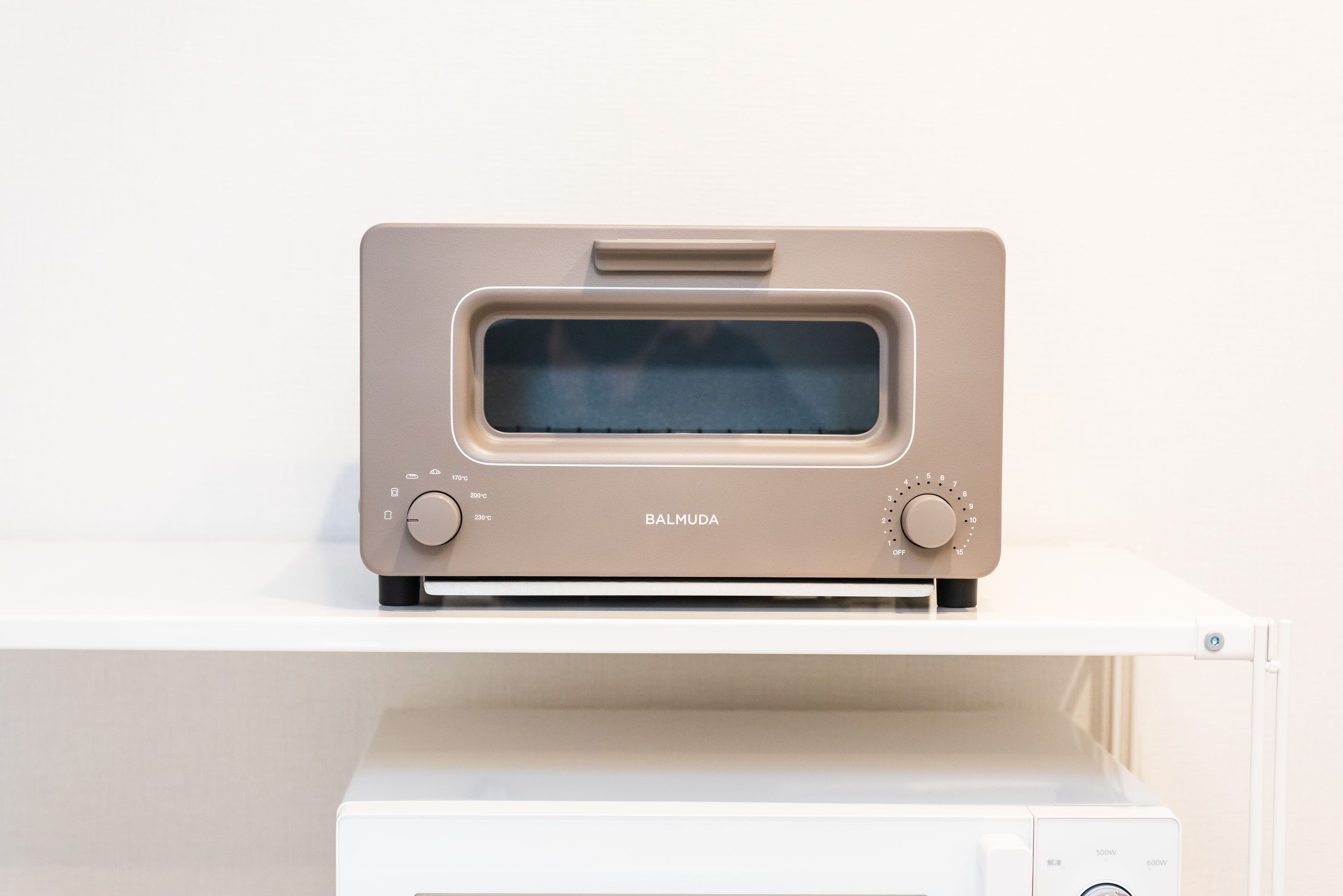 A beige Barmuda oven on a white countertop.