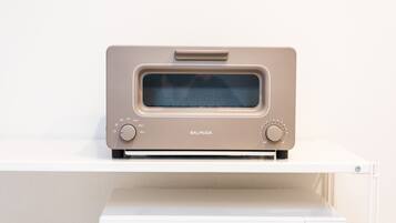 A beige Barmuda oven on a white countertop.