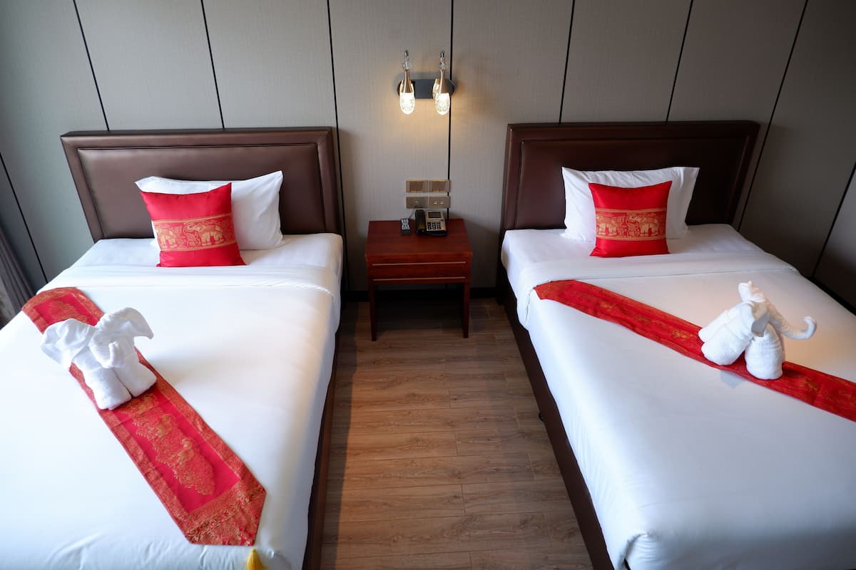 Deluxe Room (No Boat Transfer) | Minibar, in-room safe, desk, laptop workspace