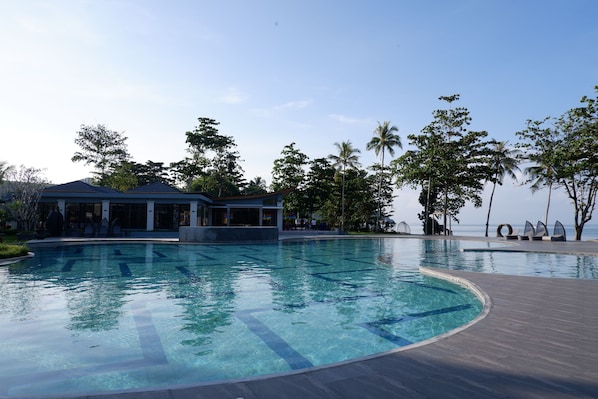 Outdoor pool, pool umbrellas, sun loungers