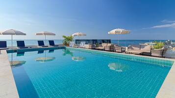 Seasonal outdoor pool, pool loungers