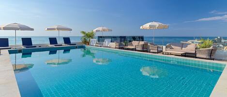 Seasonal outdoor pool, open 11:00 AM to 7:00 PM, sun loungers