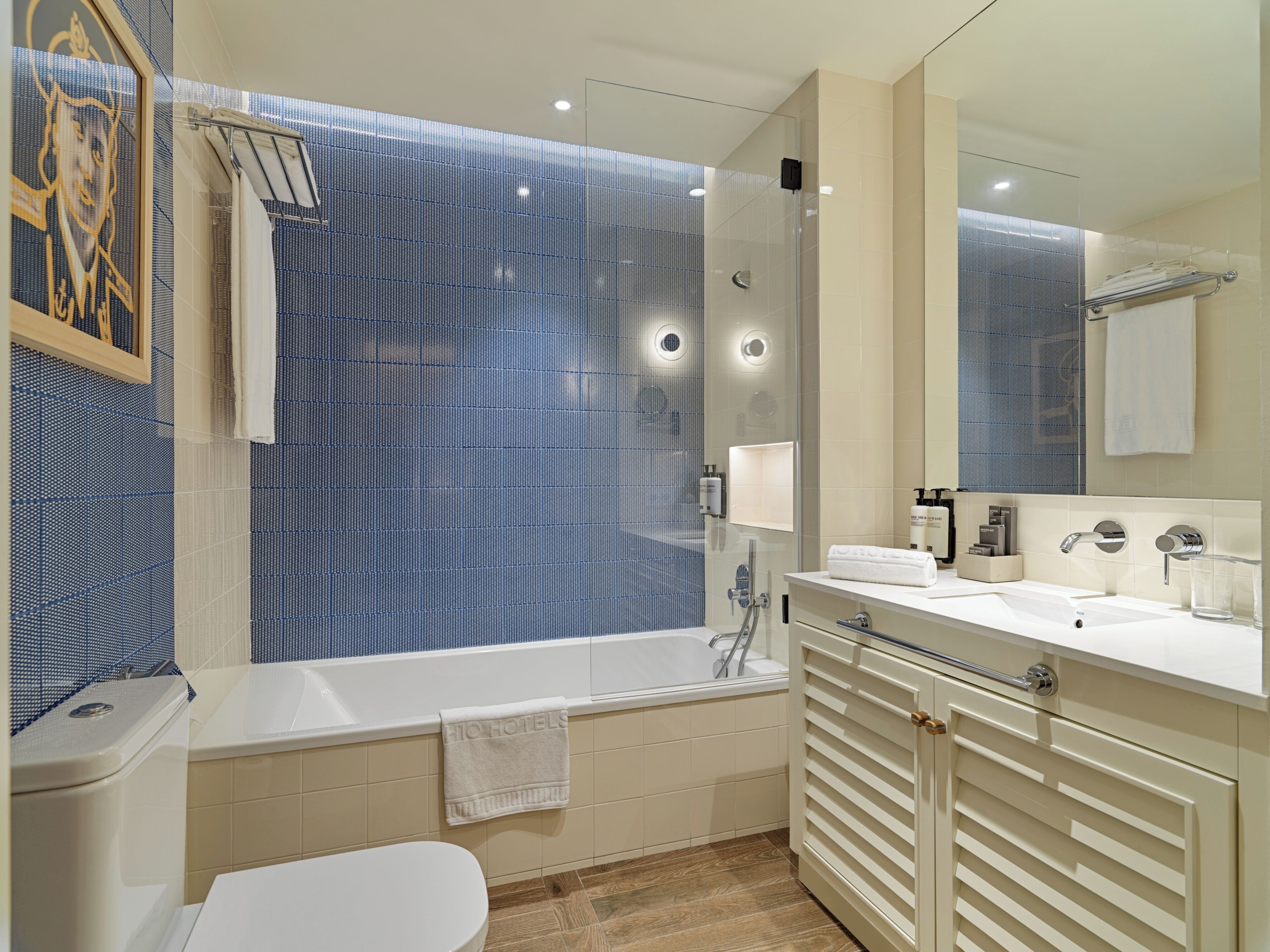 rainfall showerhead, eco-friendly toiletries, hair dryer, towels