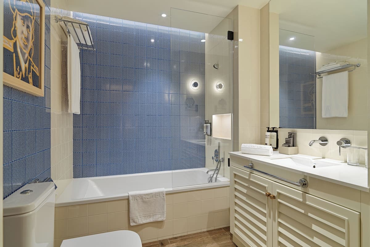 rainfall showerhead, eco-friendly toiletries, hair dryer, towels