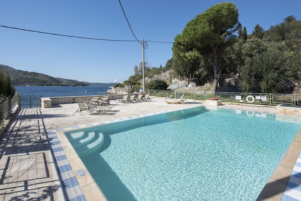 Seasonal outdoor pool, pool loungers