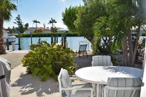 Outdoor dining - New Listing!  East facing home on widest water canal! Beautiful, cool sunrises! (Key Colony Beach)