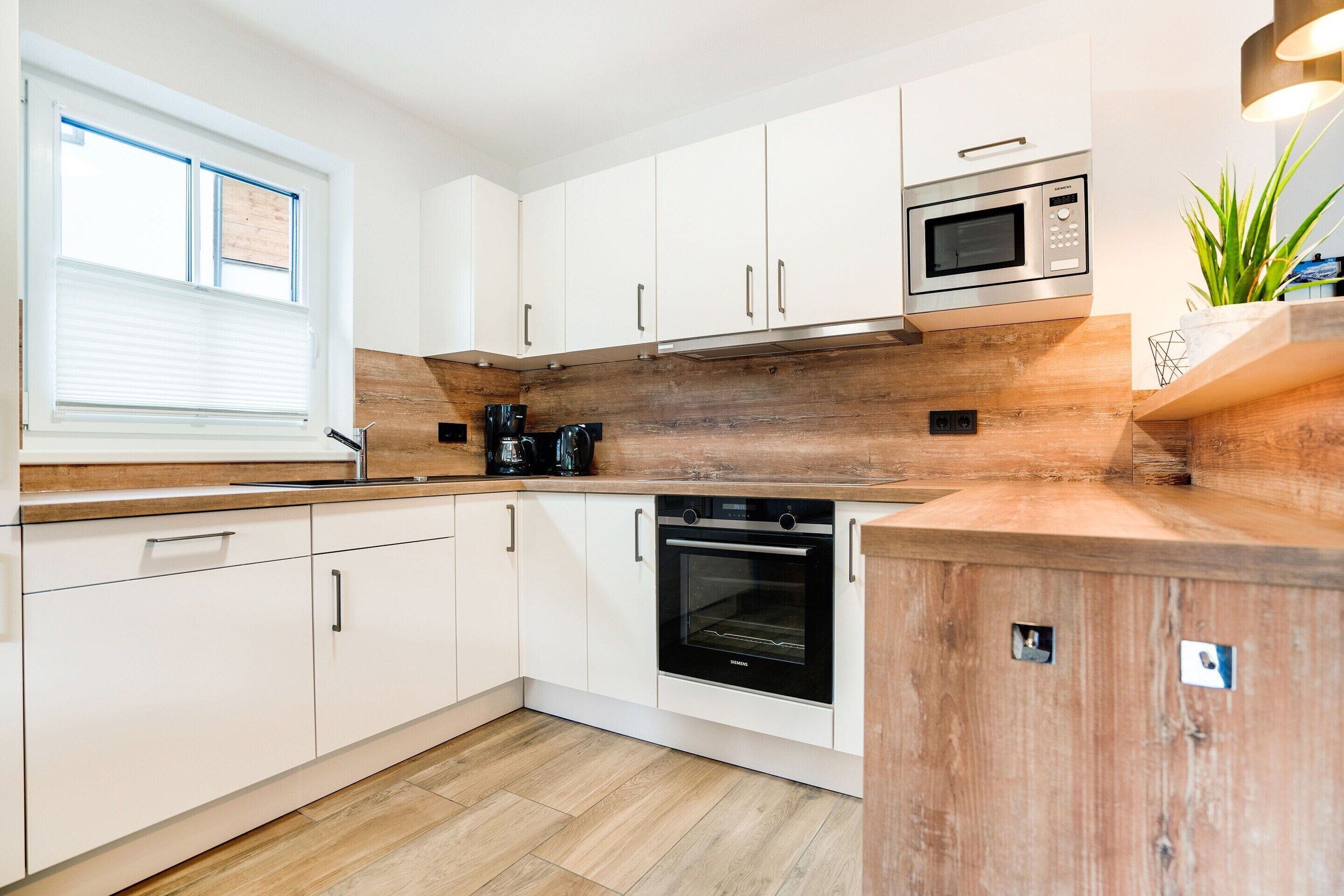 Chalet | Private kitchen | Fridge, highchair