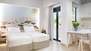 A modern bedroom with a large bed, a small table, and a view of the outdoors.