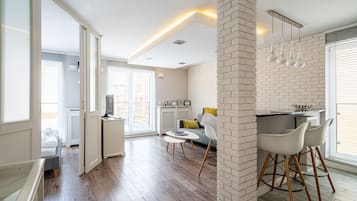 Comfort Apartment | Living area | Flat-screen TV