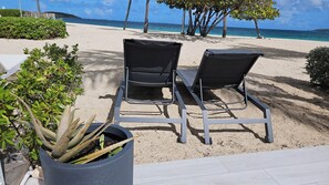 On the beach, sun loungers, beach towels