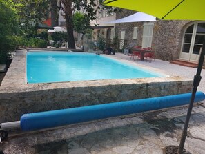 Seasonal outdoor pool, pool umbrellas, pool loungers
