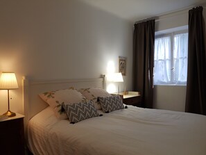 Desk, laptop workspace, blackout curtains, iron/ironing board