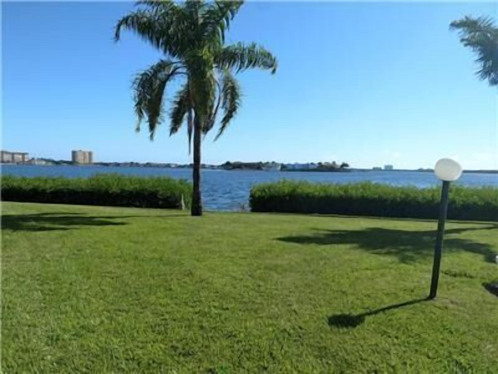 Incredible ground floor villa with water views of Bay and waterside pool!