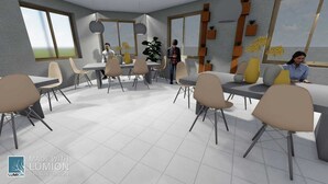 Una sala de conferencias moderna con varias mesas y sillas, ventanas amplias y una planta.