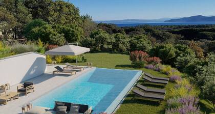 Design beachfront villa, private pool, a/c, WiFi, garden and parking space