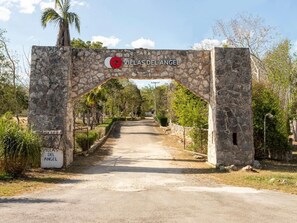 A stone archway with the sign 'Villas del Angel' indicating a property entrance. - Villas del Angel (Valladolid)