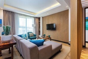 Executive Apartment, 1 Bedroom | Living area | 55-inch flat-screen TV with satellite channels, TV, Netflix - Ulwazi Place Hotel By Trianum (Nairobi)