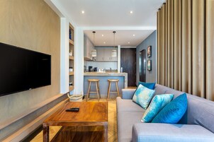 Executive Apartment, 1 Bedroom | Living area | 55-inch flat-screen TV with satellite channels, TV, Netflix