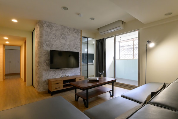 Bright and Spacious Living Room:
• 50" Flat Screen TV
• Large Comfy Sofa