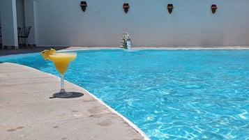 2 outdoor pools, open 9:00 AM to 9:00 PM, pool loungers