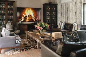 Familievilla - flere senge - aircondition - udsigt til have | Opholdsområde | Bøger