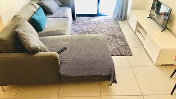 Deluxe Apartment, 2 Bedrooms | Living room | 32-inch LED TV with digital channels, TV