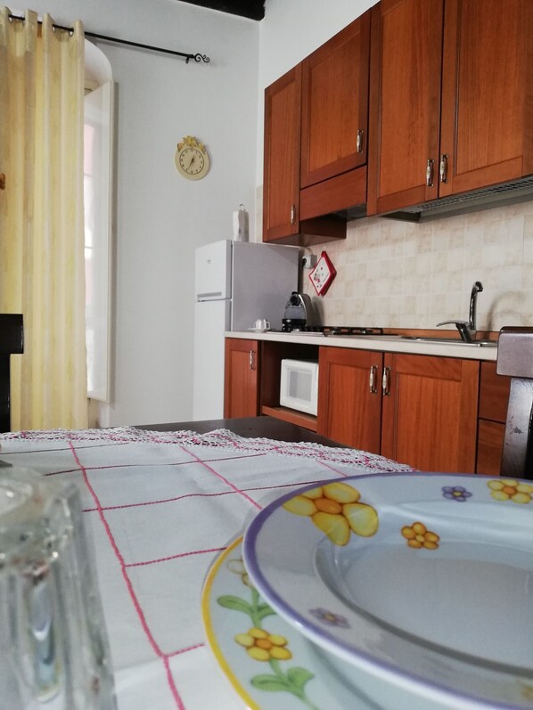 Fridge, microwave, stovetop, coffee/tea maker