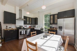 Enjoy cooking in this well-equipped kitchen with a large island, oven, and modern appliances.
