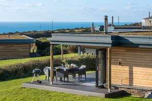 Outdoor dining - A stunning eco-home with cedar cladding, a sedum roof & state-of-the-art design. (Chapel Porth)
