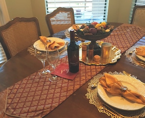 Enjoy a formal dining experience with fine tableware and elegant settings.
