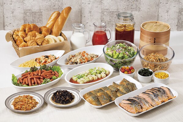 A variety of dishes including seafood, salads, and bread.