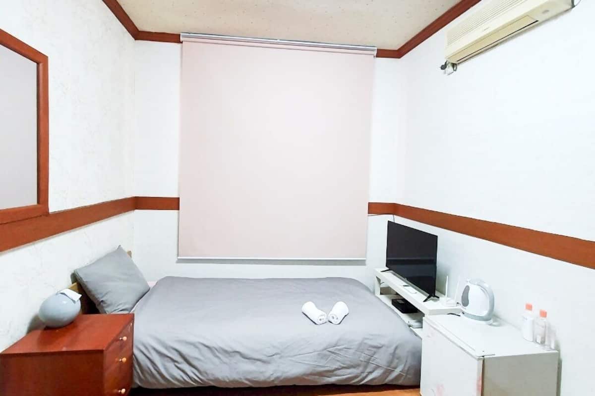 Quarto solteiro, 1 cama de solteiro | Individualmente decorados, individualmente mobiliados, Wi-Fi de cortesia
