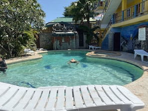 Outdoor pool, open 8:00 AM to 10:00 PM, sun loungers
