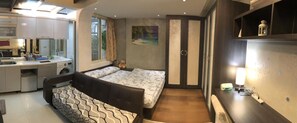 Chambre triple Élite | Décor unique, ameublement unique, système d’insonorisation